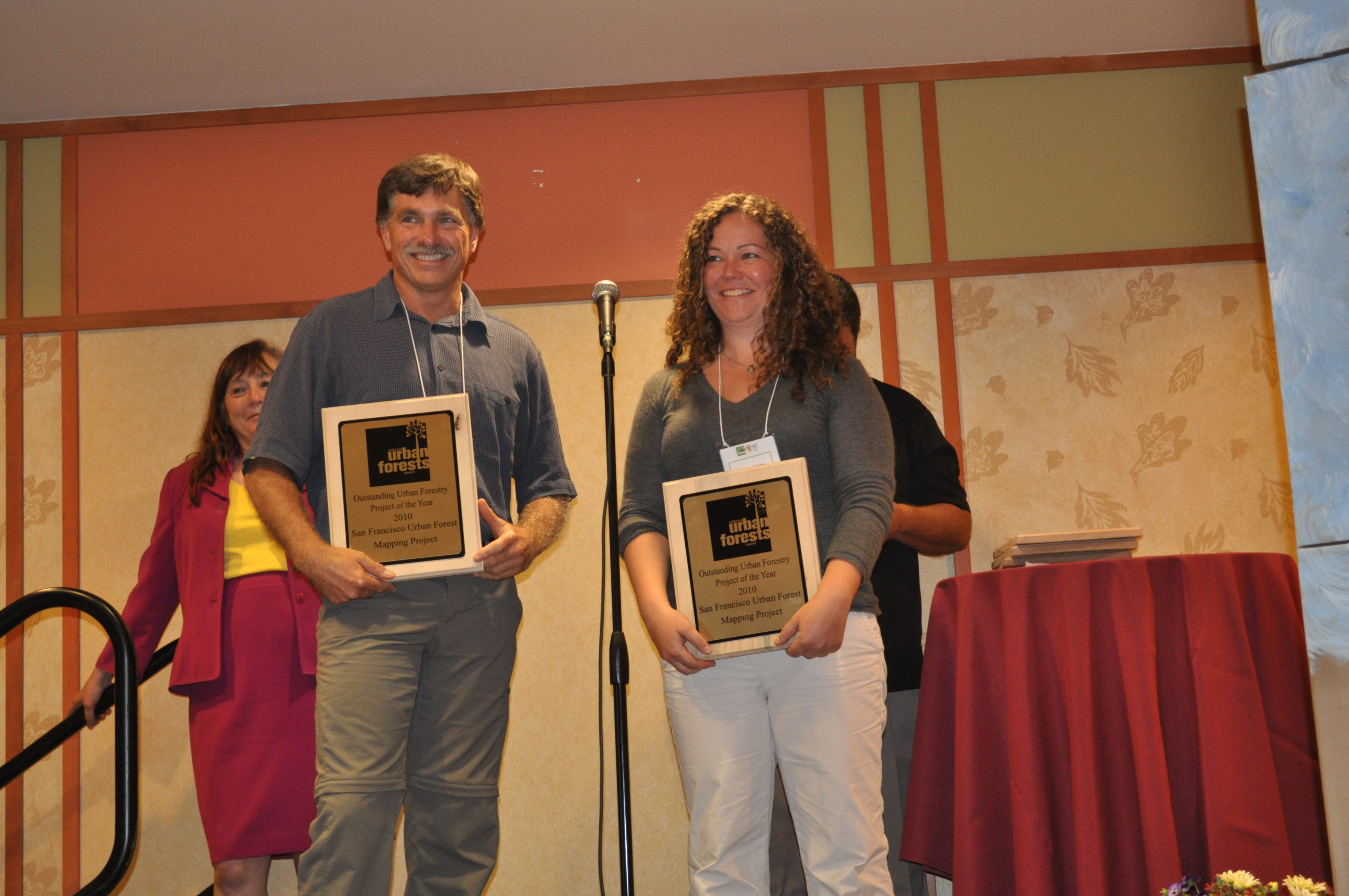 Doug Wildman and Kelaine Vargas accept awards for their innovative SF Urban Forest Map project.